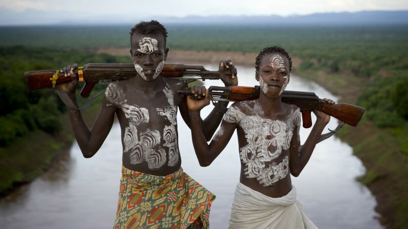 Members of the Karo Tribe pose with AK-47s in Korcho, Ethiopia, in 2008.