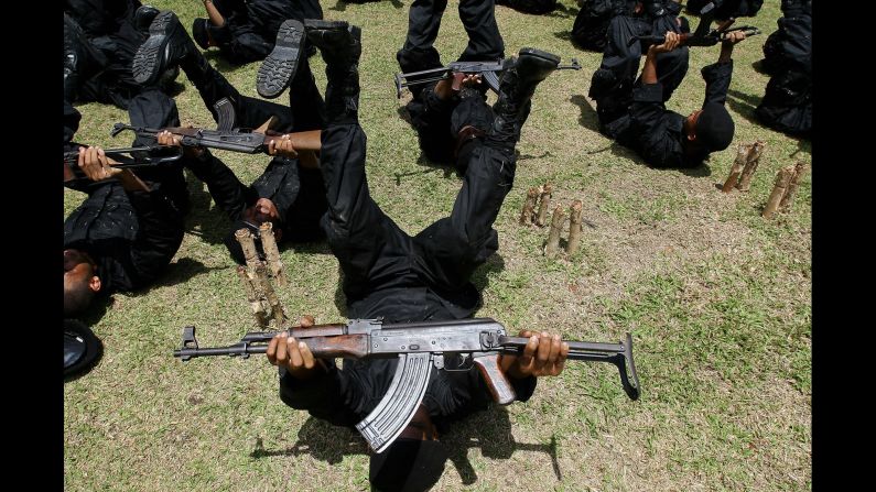 Newly recruited Rangers practice with their AK-47s during a training session at a military camp in the southern Narathiwat province of Thailand in 2009.