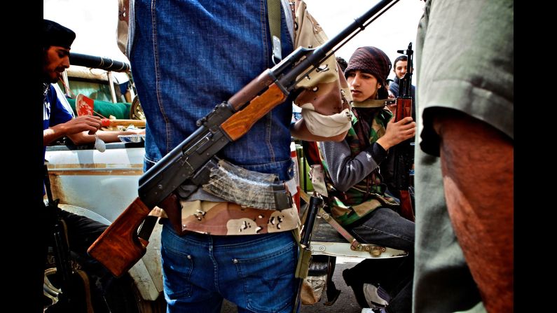 Anti-Libyan-government militants gather on the front line in Brega, Libya, in 2011.