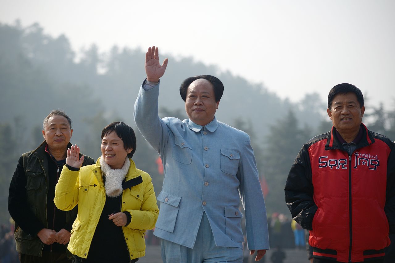 An actor playing China's former leader Mao Zedong waves as people gather in China's central province of Hunan on December 24 to celebrate Mao's 120th anniversary today. These photos show how the country prepares to commemorate his birthday and how he is remembered in China. 