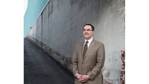 Embattled but resilient Mayor Vince Gray stands outside a charter school in Northeast Washington. - (Charles Ommanney for CNN)