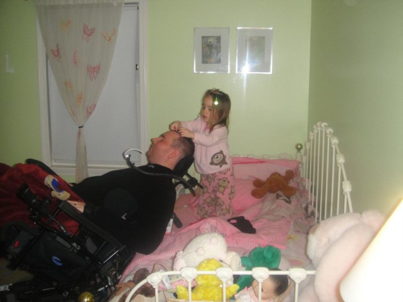Izzy puts clips in her dad's hair in 2010. "They love being silly together and for all his big talk about being in charge and her listening to him, he'll do whatever she wants," Hayes said.