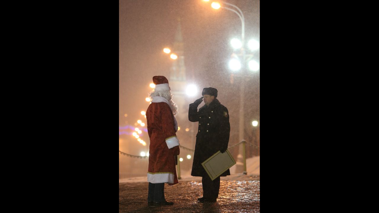 A timber truck driver dressed as Father Frost is seen at the Kremlin's Spasskiye [Saviour] Gate on Saturday, December 21.