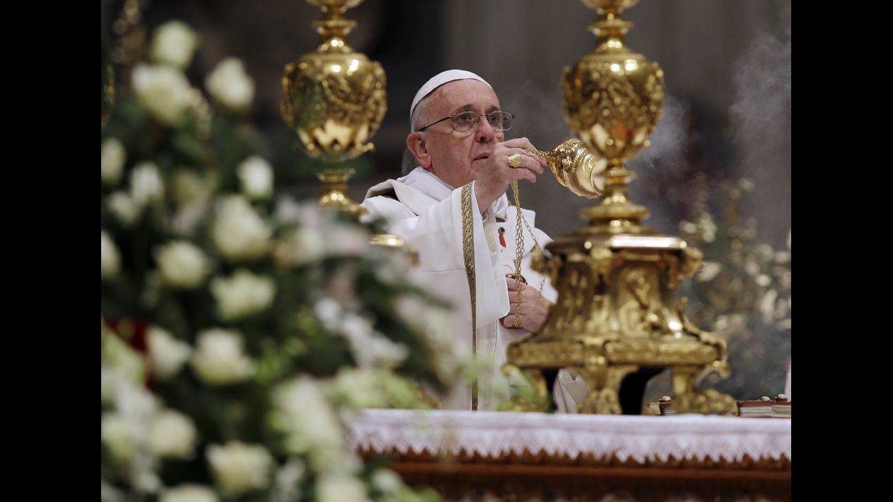 The Pope waves incense during the celebration.