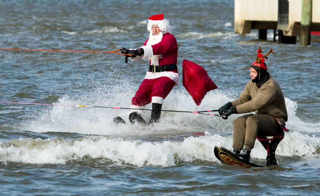 A water-skiing Santa Clause and a reindeer head down the Potomac River at National Harbor, Maryland, on December 24.
