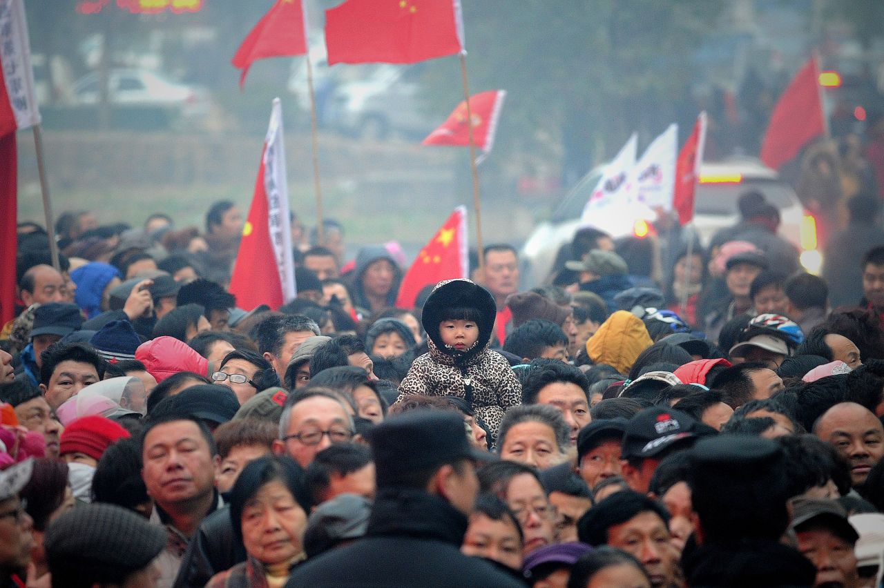 People wait to eat free noodle in Mao Zedong's anniversary of 120 birthday at his hometown in Shaoshan, China. 