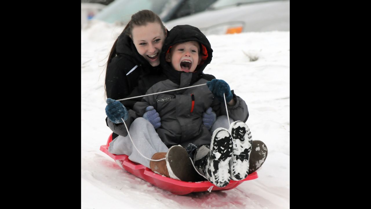 Shannon Abbott of Byron Center, Michigan, and her cousin, P.J. Swainston, slide on the slopes near Dorr, Michigan, on Wednesday, December 25.