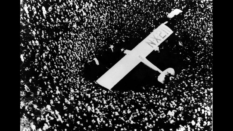 The Spirit of St. Louis is surrounded by spectators after its pilot, Charles Lindbergh, completed his historic trans-Atlantic flight in May 1927. Lindbergh flew nonstop from Long Island, New York, to Paris.