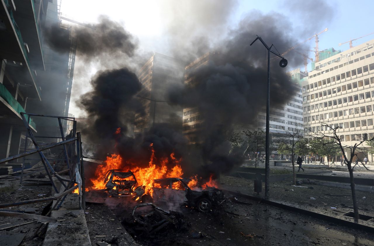 Flames pour from vehicles after an explosion in Beirut, Lebanon, on Friday, December 27. A car bombing shook the Lebanese capital, sending black smoke billowing a few hundred meters from the government headquarters and Parliament building.