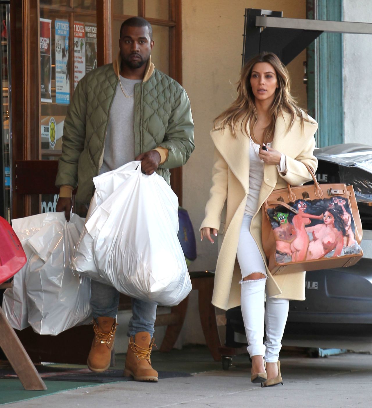 Kanye West and Kim Kardashian shop at a sporting goods store in Los Angeles on December 26.