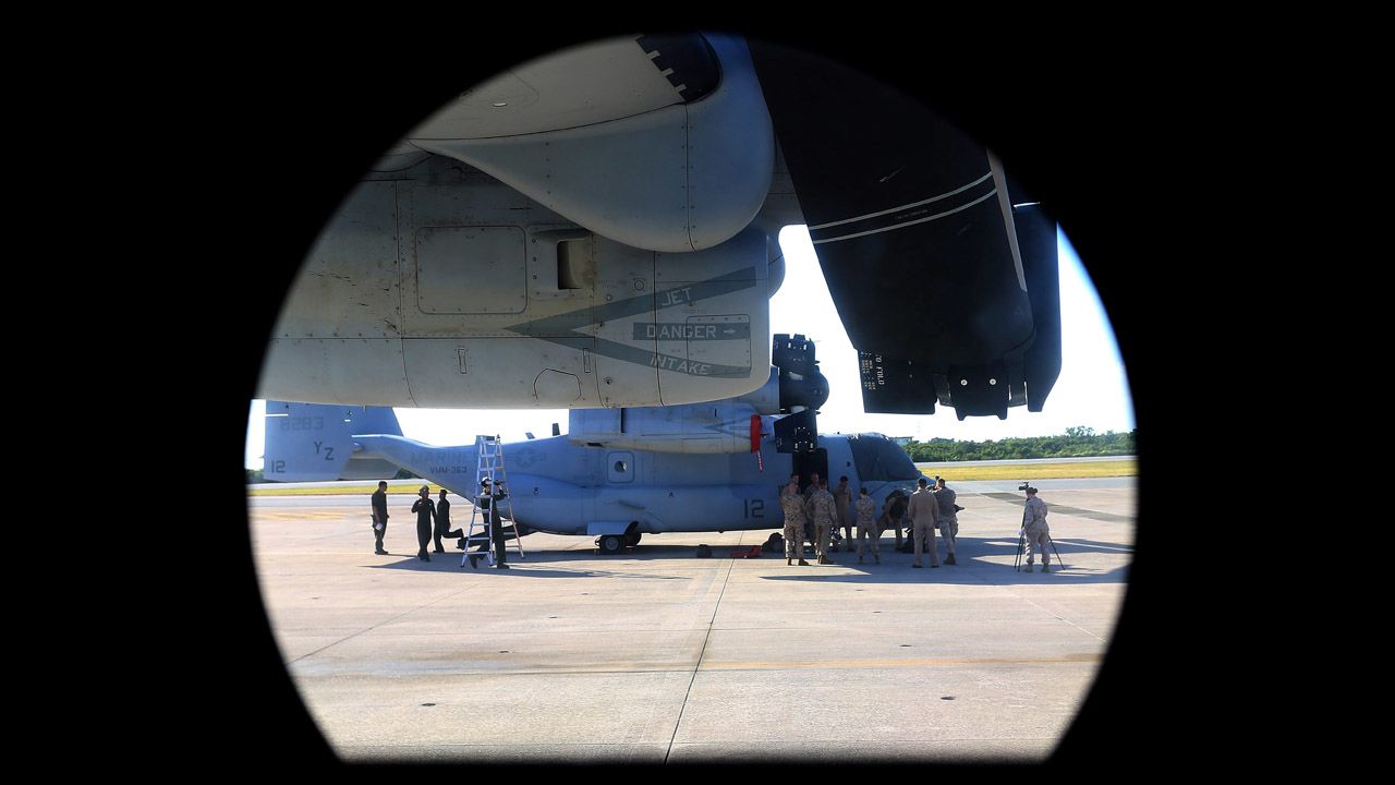A U.S. Marine Corps' MV-22 Osprey tilt-rotor aircraft is seen through the window of another Osprey at Futenma on August 3. 