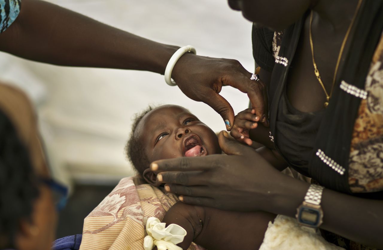 One-month-old Nhial Hoan Malual receives treatment for dehydration and chest pains in a medical tent run by Doctors Without Borders at the U.N. compound in Juba on December 27. 