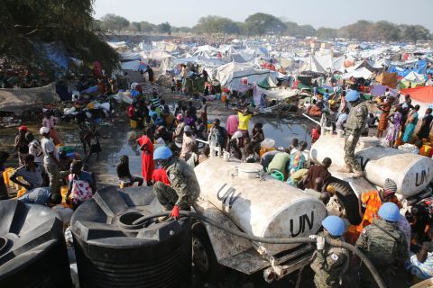 South Korean soldiers provide water at a refugee camp in South Sudan on Thursday, December 26. Hundreds of South Korean soldiers are stationed in the town of Bor as part of United Nations peacekeeping forces. 