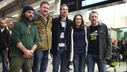 LONDON, ENGLAND - DECEMBER 27: Freed Greenpeace activists (L-R) Iain Rogers, Anthony Perrett, Kieron Bryan, Alexandra Harris and Phil Ball pose for a photograph after arriving at St Pancras railway station on December 27, 2013 in London, England. The activists were released after being granted an amnesty by the Russian authorities. They have spent the last 100 days in prison after being arrested during a protest against oil drilling in the Arctic. (Photo by Peter Macdiarmid/Getty Images)