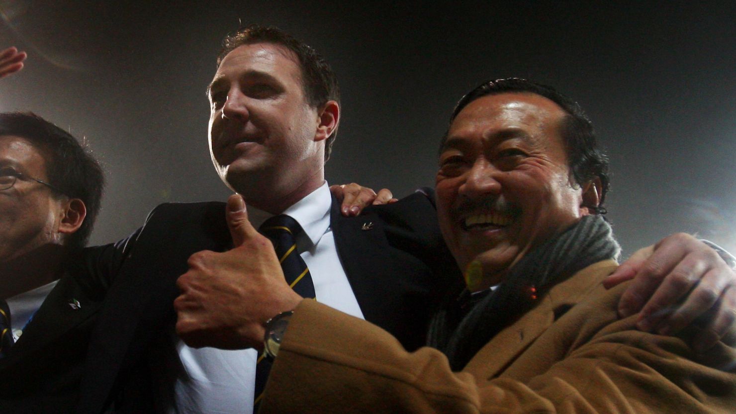 All together then: Vincent Tan (far right) and Malky Mackay celebrate an English League Cup semifinal win in 2012.