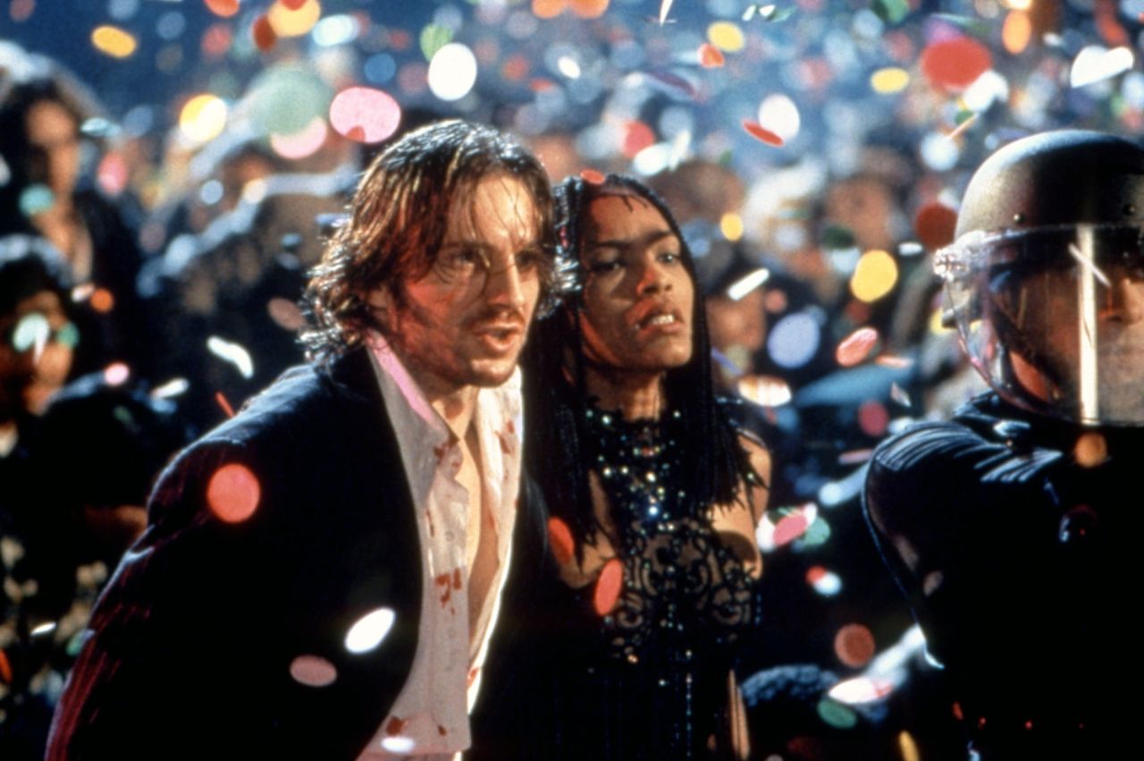 <strong>"Strange Days" </strong>--<strong> </strong>"Cheer up, world's going to end in 10 minutes anyway," Tom Sizemore tells his friends during Kathryn Bigelow's sci-fi thriller, which takes place in the last day or so of the 20th century, when everyone was partying like it was 1999 (well, because it was). Black-market dealer Lenny (Ralph Fiennes) and his bodyguard Mace (Angela Bassett) try to solve a rape and murder caught on a tape that was recorded directly from the victim's cerebral cortex. Talk about a new way of experiencing other people's memories. Maybe some other New Year's Eve, this will be how we watch movies -- jacking in.