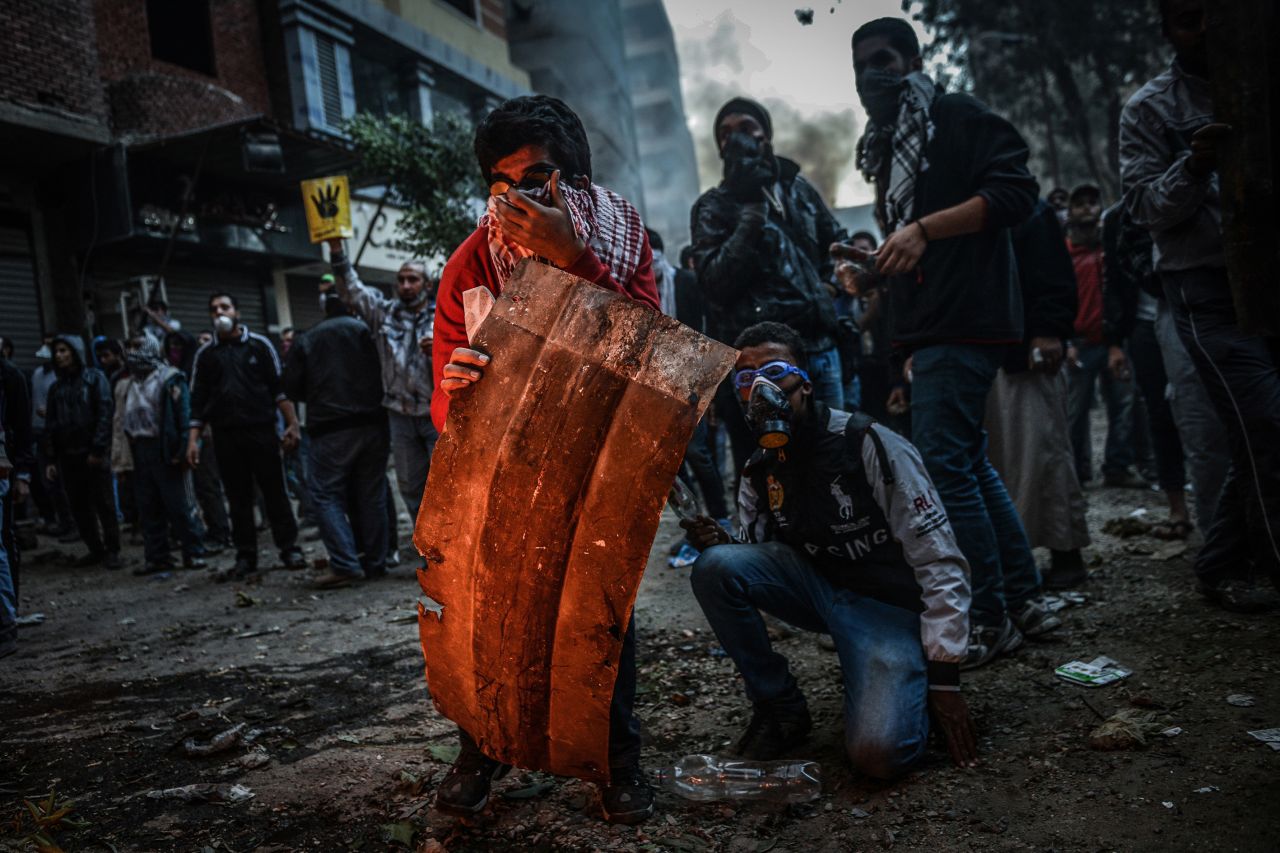 <strong>December 27:</strong> Egyptian protesters and police clash in Cairo during a demonstration against the government's declaration of the Muslim Brotherhood as a terrorist organization.