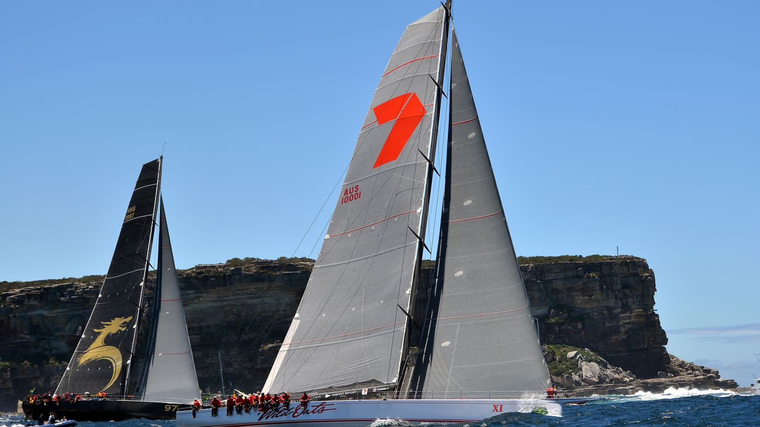 Wild Oats XI, right, cruised to a seventh Sydney-Hobart yacht crown on Saturday, winning by more than three hours. 