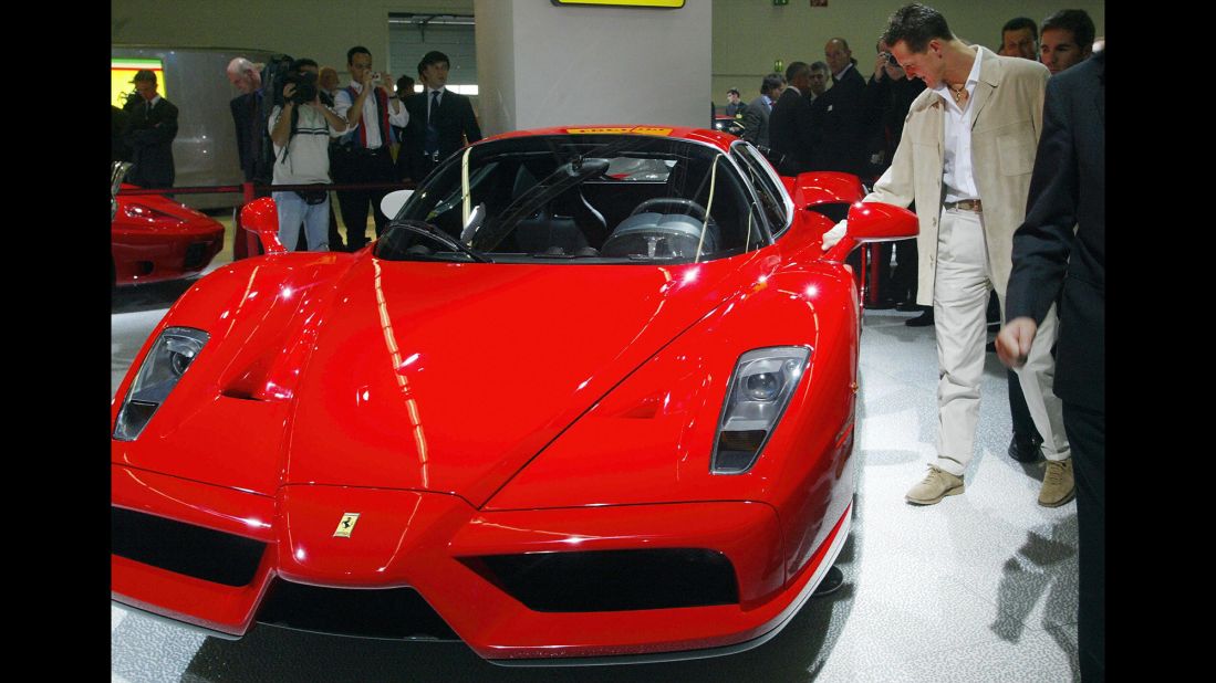 Schumacher checks out an Enzo Ferrari at Frankfurt's International Motor Show in 2003.