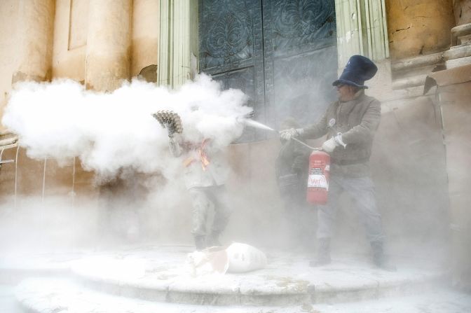 As if things weren't gooey enough, Ibi's camo-clad men add fire extinguishers into the mix. <br /><a href="index.php?page=&url=http%3A%2F%2Fedition.cnn.com%2F2013%2F07%2F02%2Ftravel%2Fworlds-messiest-festivals%2Findex.html">READ: The World's messiest festivals</a>