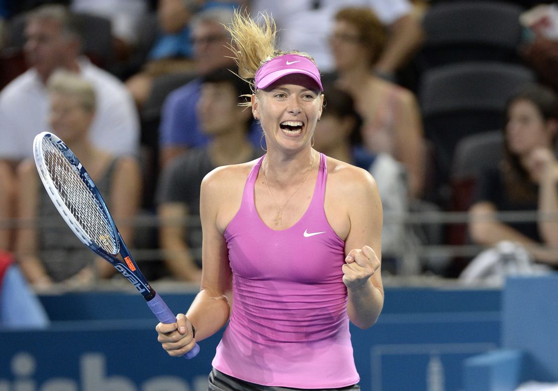 Maria Sharapova celebrates her comeback victory against Caroline Garcia of France during day two of the 2014 Brisbane International in Queensland.