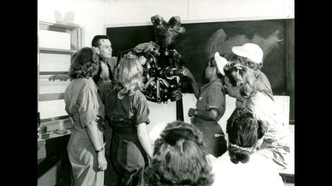WASPs study in engines class with instructor Mr. Crawford, at Avenger Field, Sweetwater, Texas.<br />