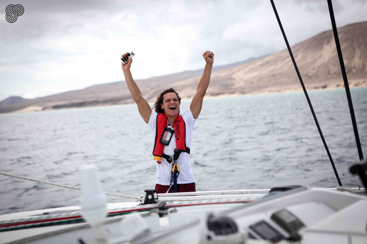 Frans celebrates as the boat leaves landfall in the Canary Islands at the start of the team's 6000km journey across the Atlantic.