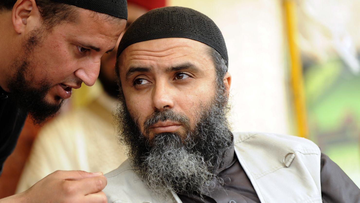 This file photo shows Seifallah Ben Hussein Mokni (R), also known as Abu Iyadh, leader of Tunisian Salafists at a meeting last year in Tunisia.