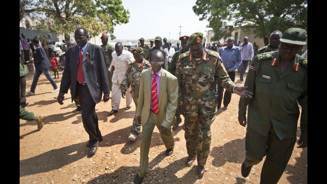 South Sudan Vice President James Wani Igga, center left, arrives to visit patients at the Juba Military Hospital on December 28. 