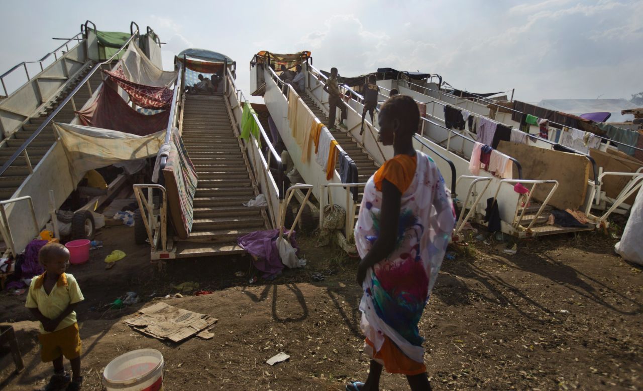 Moveable stairs used for passengers to board aircraft are repurposed into makeshift shelters at a U.N. compound in Juba on December 29.