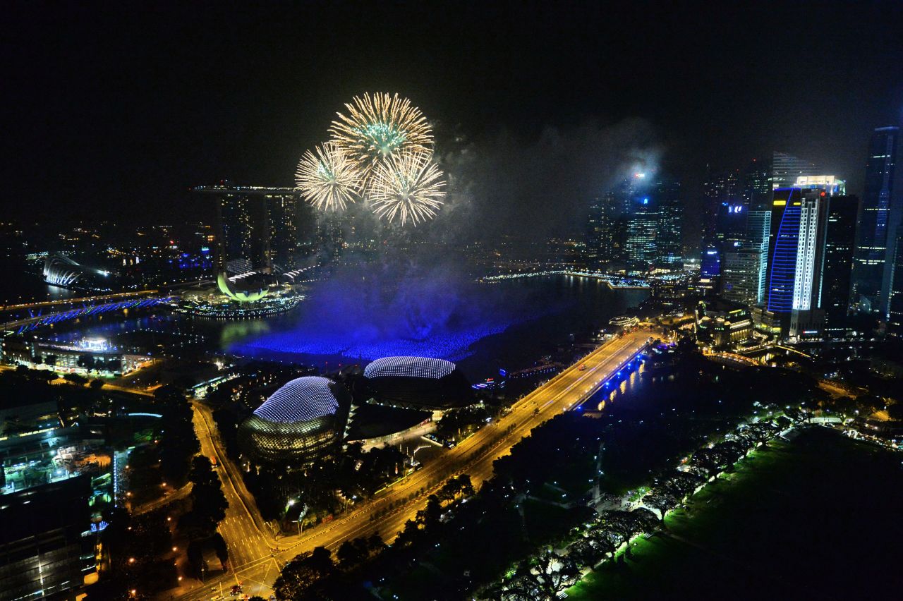 Fireworks burst over the Singapore skyline during New Year's celebrations.