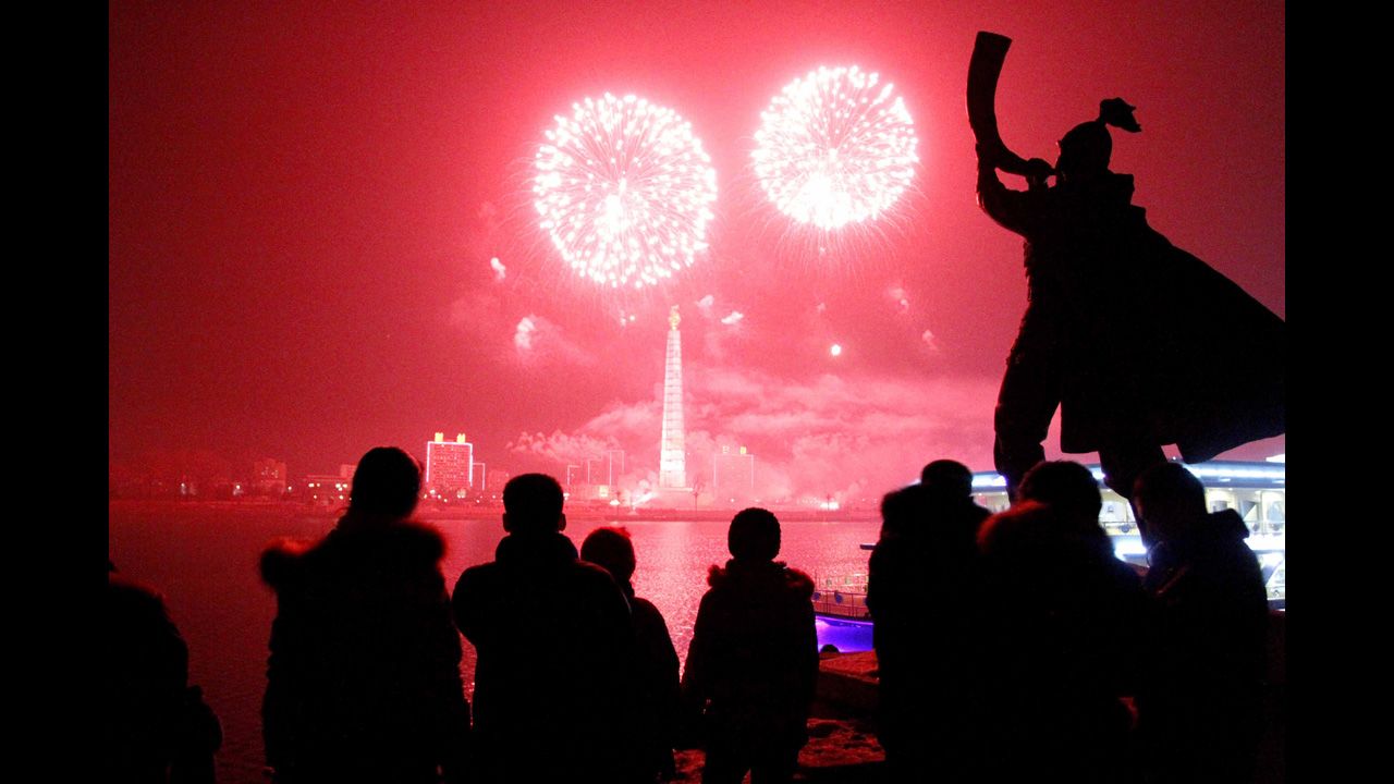 Fireworks explode over Juche Tower and the Taedong River in Pyongyang, North Korea.