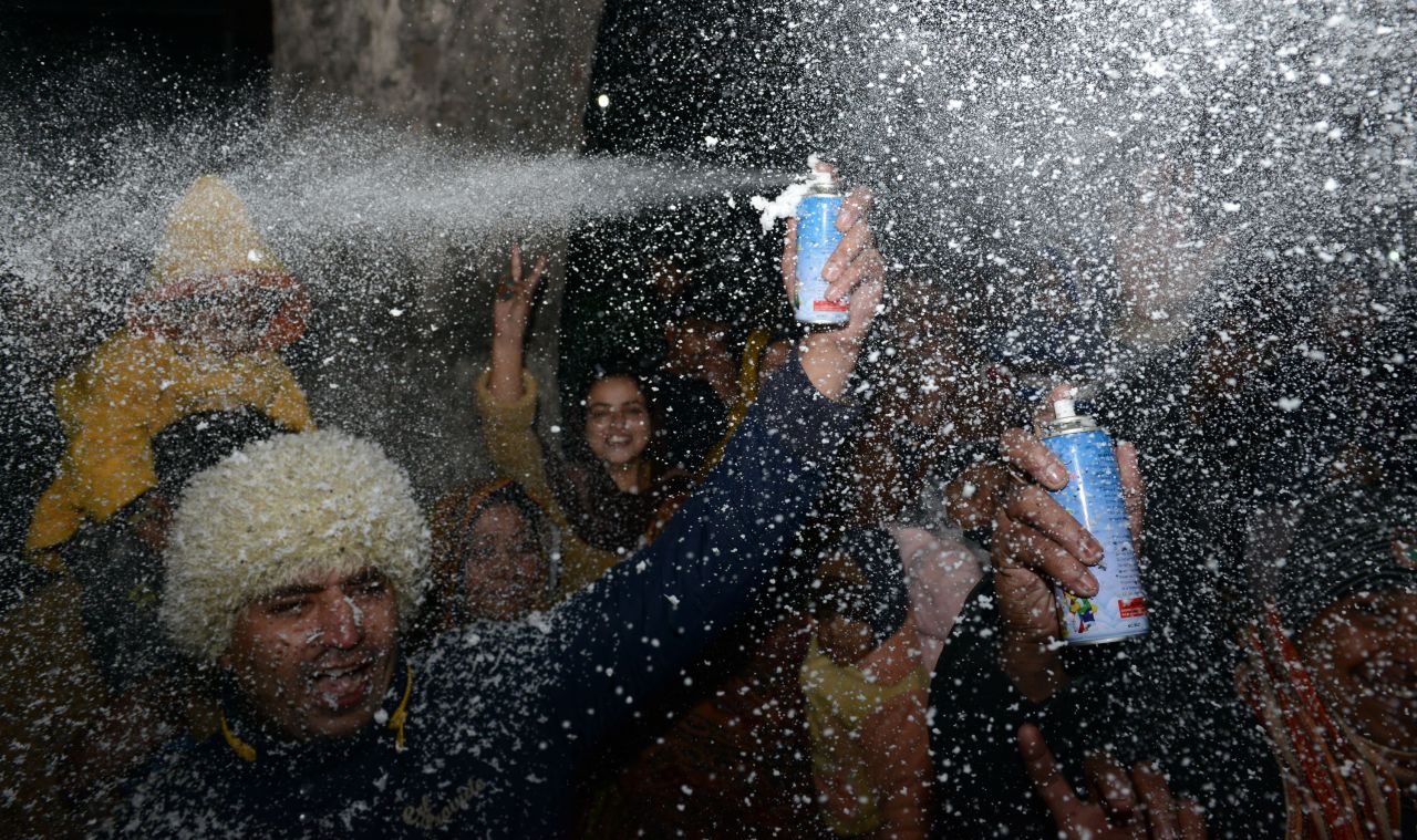 Pakistani youth gather to celebrate New Year's on a street in Lahore.