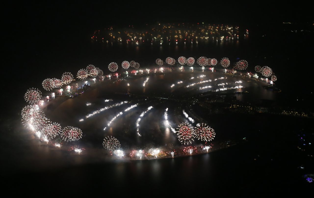 New Year's fireworks explode over Palm Jumeirah in Dubai, United Arab Emirates. Dubai set a new world record for largest fireworks display, according to Guinness World Records. The show featured 400,000 pyrotechnics and spanned more than 100 kilometres (62 miles).