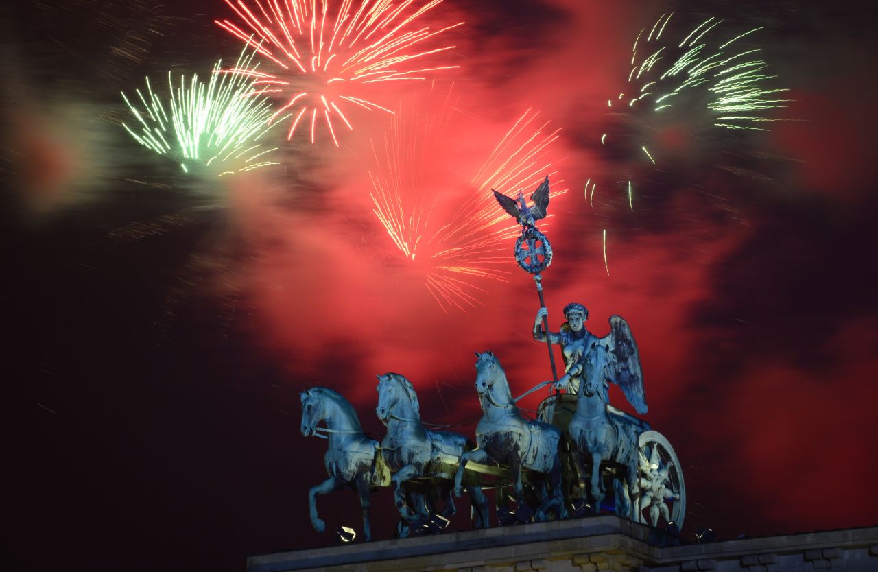 Fireworks explode over the landmark Brandenburg Gate to bring in the new year in Berlin on Wednesday, January 1.