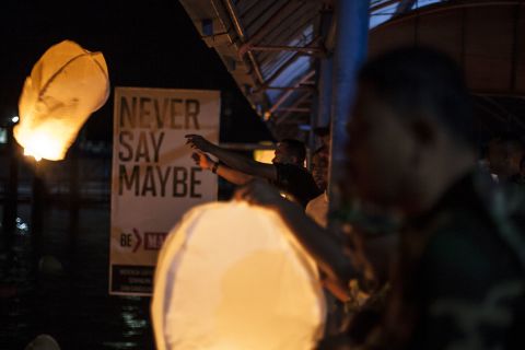 Indonesian military members release lanterns into the sky from Bintan Island, Indonesia.