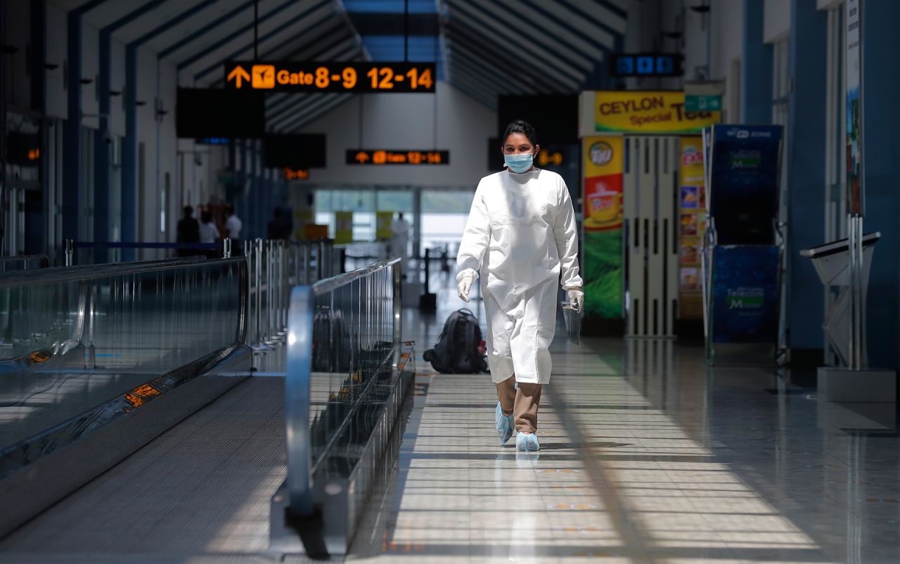 A Sri Lankan airport worker walks inside a terminal at the Katunayake International Airport in Colombo, Sri Lanka, on January 20.