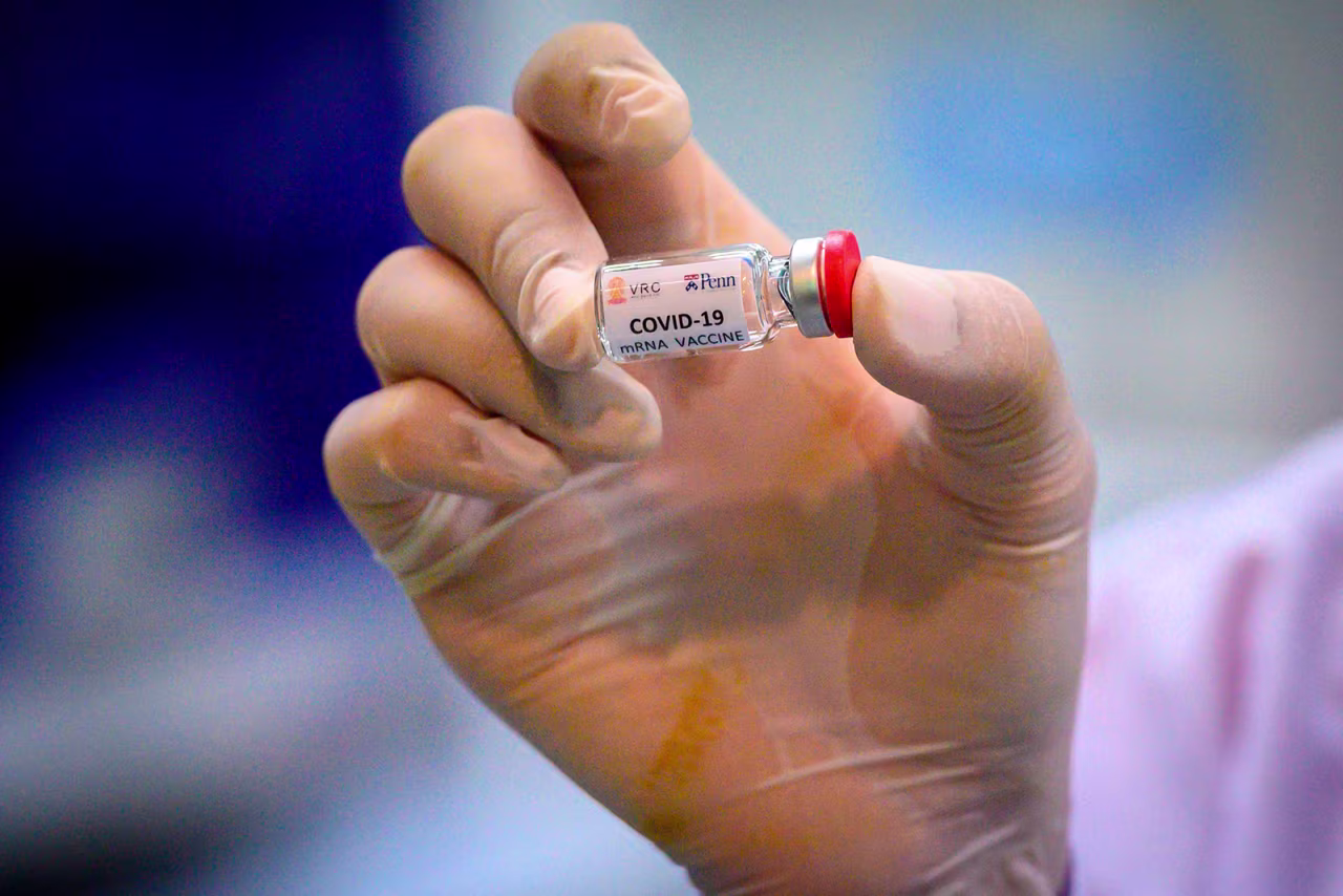 A lab technician holds a dose of a Covid-19 vaccine candidate ready for trial on monkeys at Chulalongkorn University in Saraburi in Thailand on May 23.