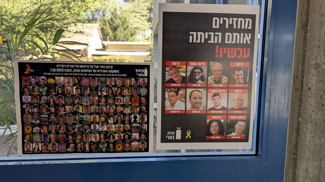 Posters displayed in the main administration building show the names and faces of the Be'eri residents killed in the October 7 attack, left, and the 10 hostages from Be'eri yet to be returned from Gaza.