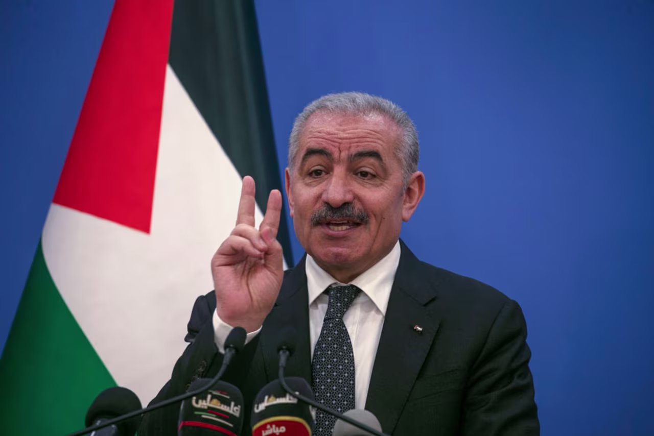 Palestinian Prime Minister Mohammad Shtayyeh gestures as he talks to reporters during a press conference in Ramallah on May 5.