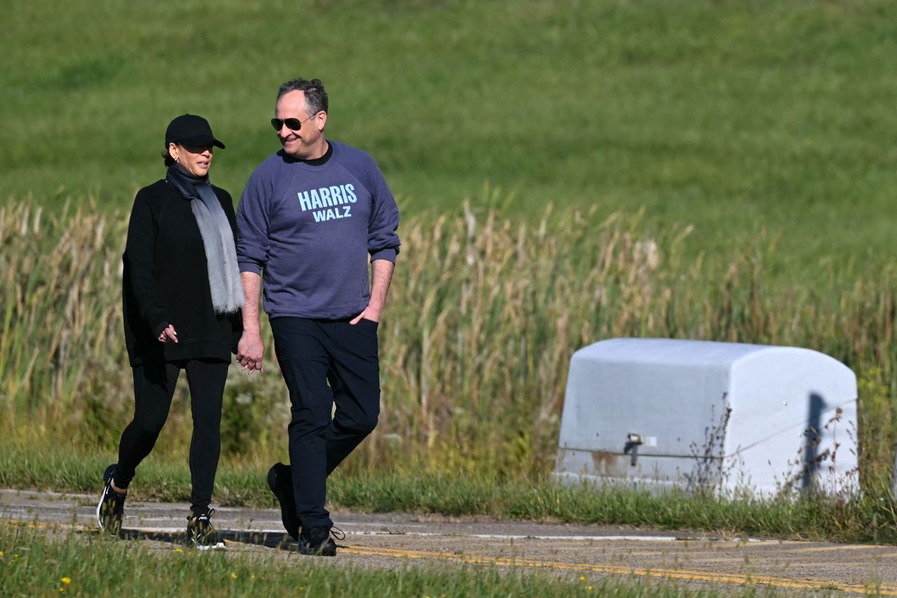 Vice President Kamala Harris walks alongside Second Gentleman Doug Emhoff at the Pennsylvania Air National Guard Base, 171st Air Refueling Wing, in Moon Township, Pennsylvania, on September 8.