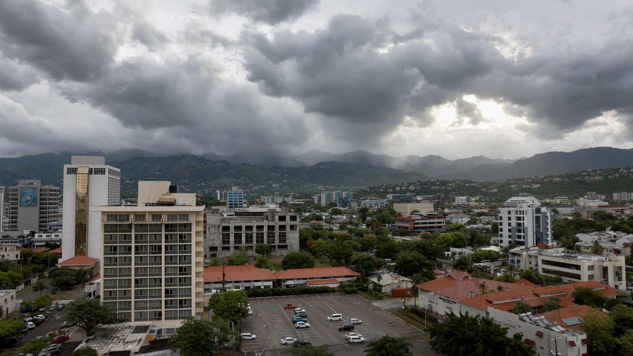 Storm clouds hover over the mountains as people make last-minute preparations for the arrival of Hurricane Beryl on July 3, n Kingston, Jamaica. 