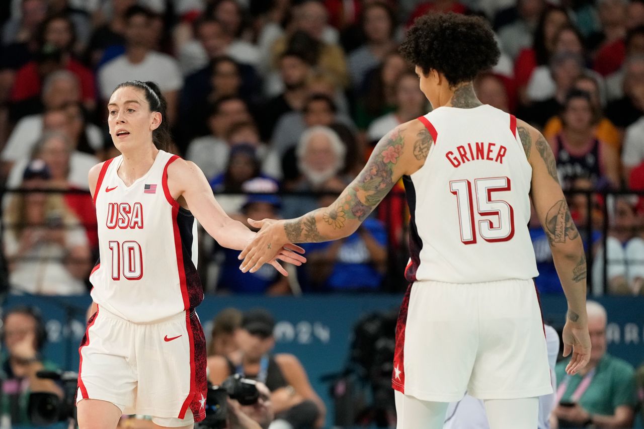 USA’s Breanna Stewart and Brittney Griner slap hands during the women's basketball semifinal against Australia on August 9.