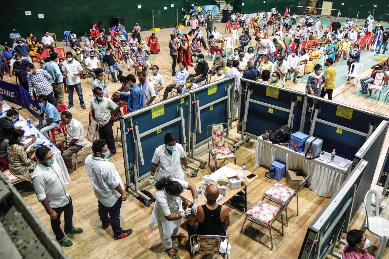 Vaccinations are carried out at an indoor stadium in Guwahati, India, on April 22. 