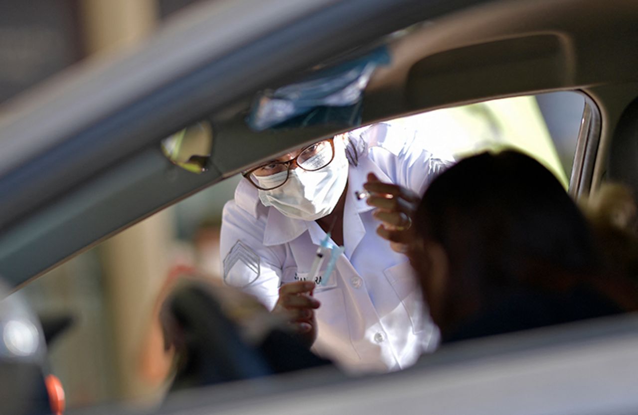 Military personnel of the Brazilian Army vaccinate elderly over 89 years of age, with the second dose of the AstraZeneca/Oxford vaccine against the novel coronavirus, COVID-19, at a drive-through vaccination centre in Belo Horizonte, State of Minas Gerais, Brazil, on May 1, 2021.?