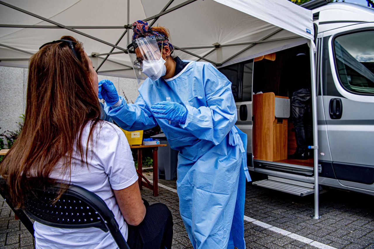 A health worker collects a sample during coronavirus screening in Maassluis, Netherlands on June 18.