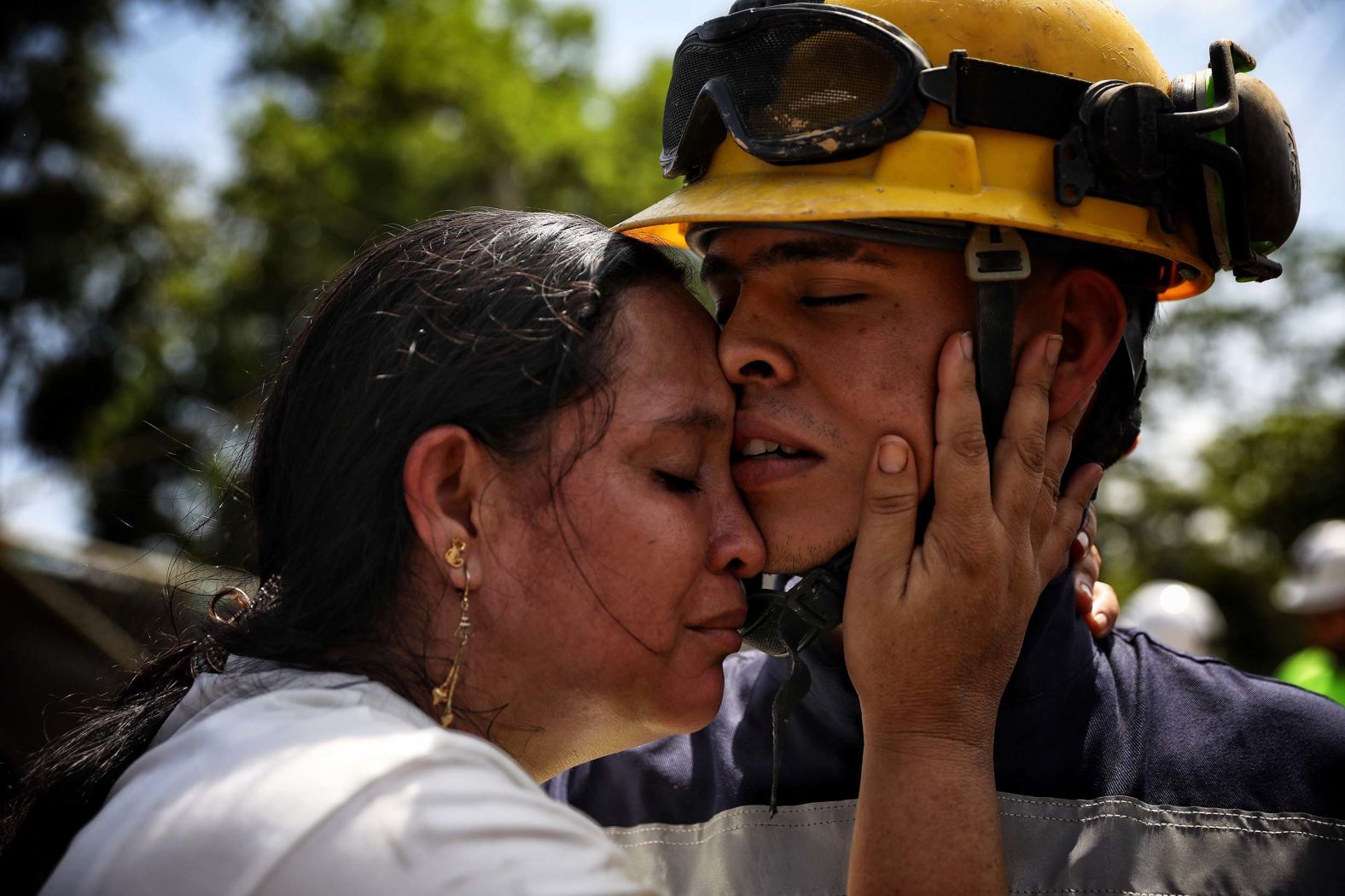 Yuliana Andrea Agudelo embraces her son Sebastian Agudelo after he was rescued from a gold mine that had collapsed in Segovia, Colombia, on Wednesday, September 24.