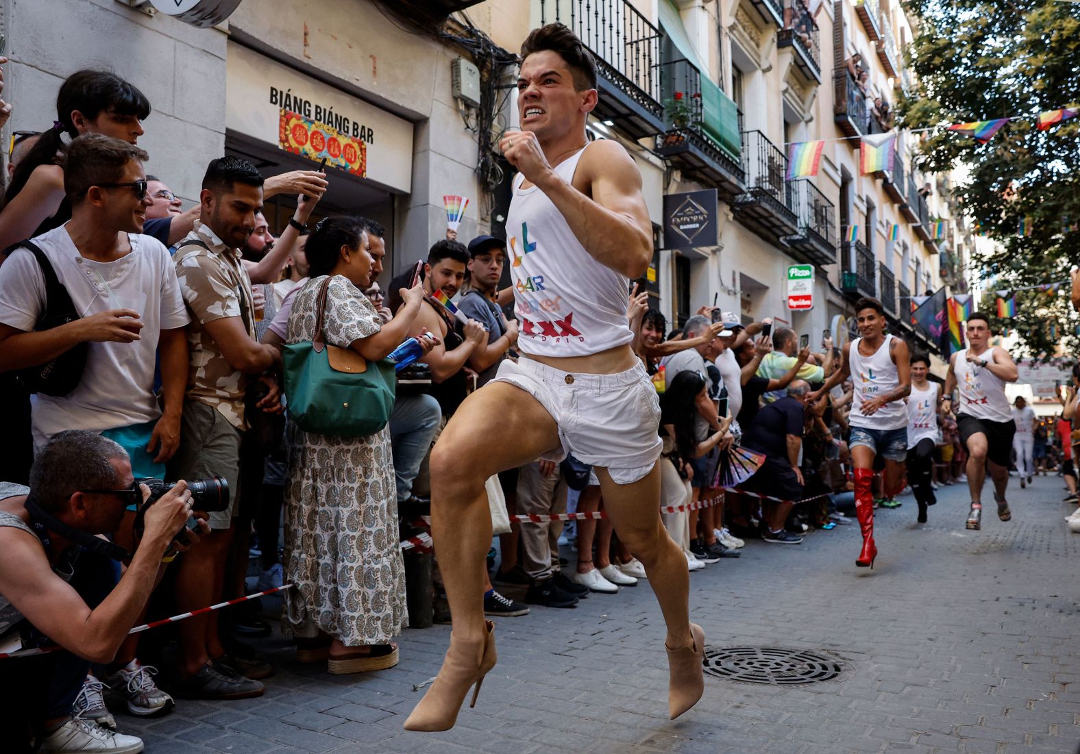 People race in high heels during Pride celebrations in Madrid on Thursday, July 4.