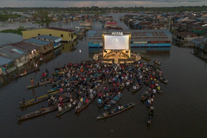 Spectators sit on boats and watch a film during the Muyuna Floating Film Festival in Iquitos, Peru, on Saturday, May 24.