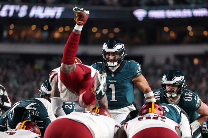 Washington Commanders linebacker Frankie Luvu dives over the line of scrimmage before a play in the NFC Championship game against the Philadelphia Eagles in Philadelphia on January 26. Luvu was penalized for offside, and the Eagles eventually scored a touchdown from less than a yard away.